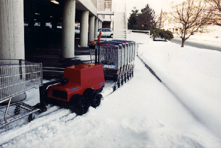 Cart Mule push and pull combo moving carts in light snow. 