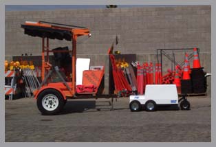 road construction equipment and traffic equipment pull on the lot